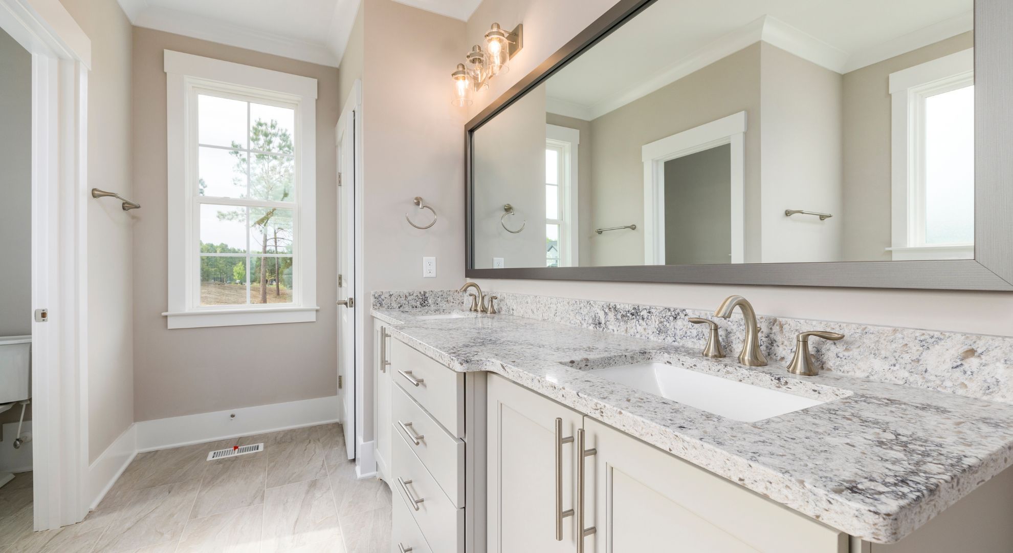off-white and granite bathroom