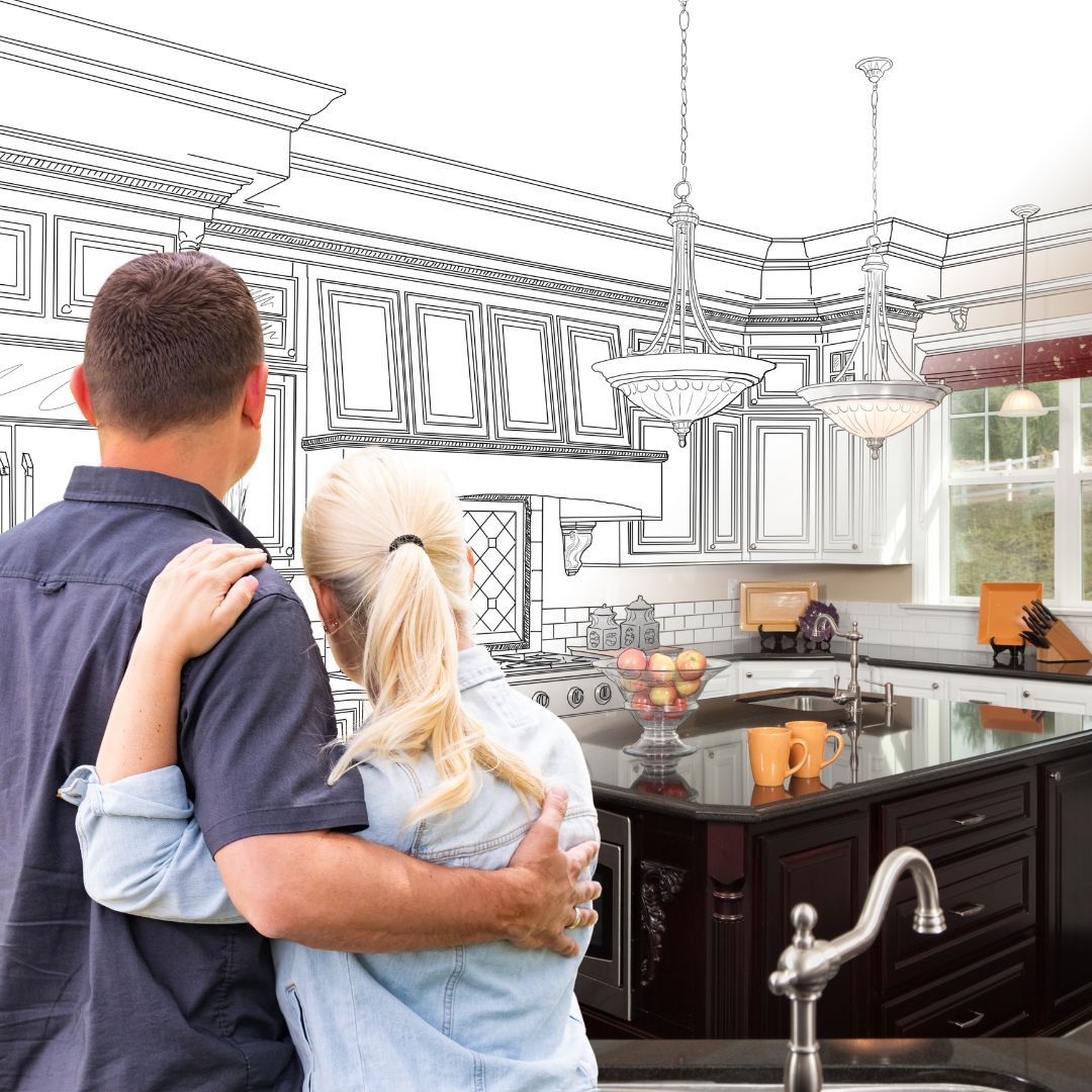 embracing couple looking at a sketch of a kitchen that is turning into the real kitchen